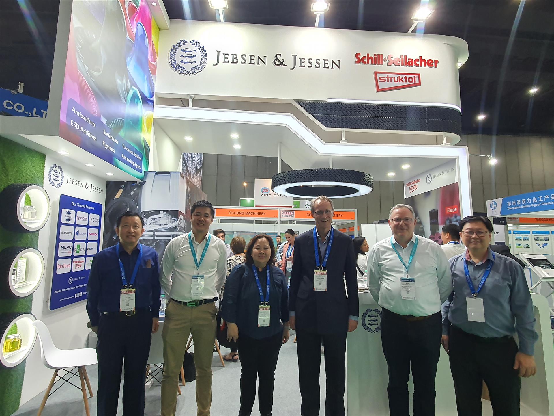 GRTE - JJ team standing in front of booth with supplier