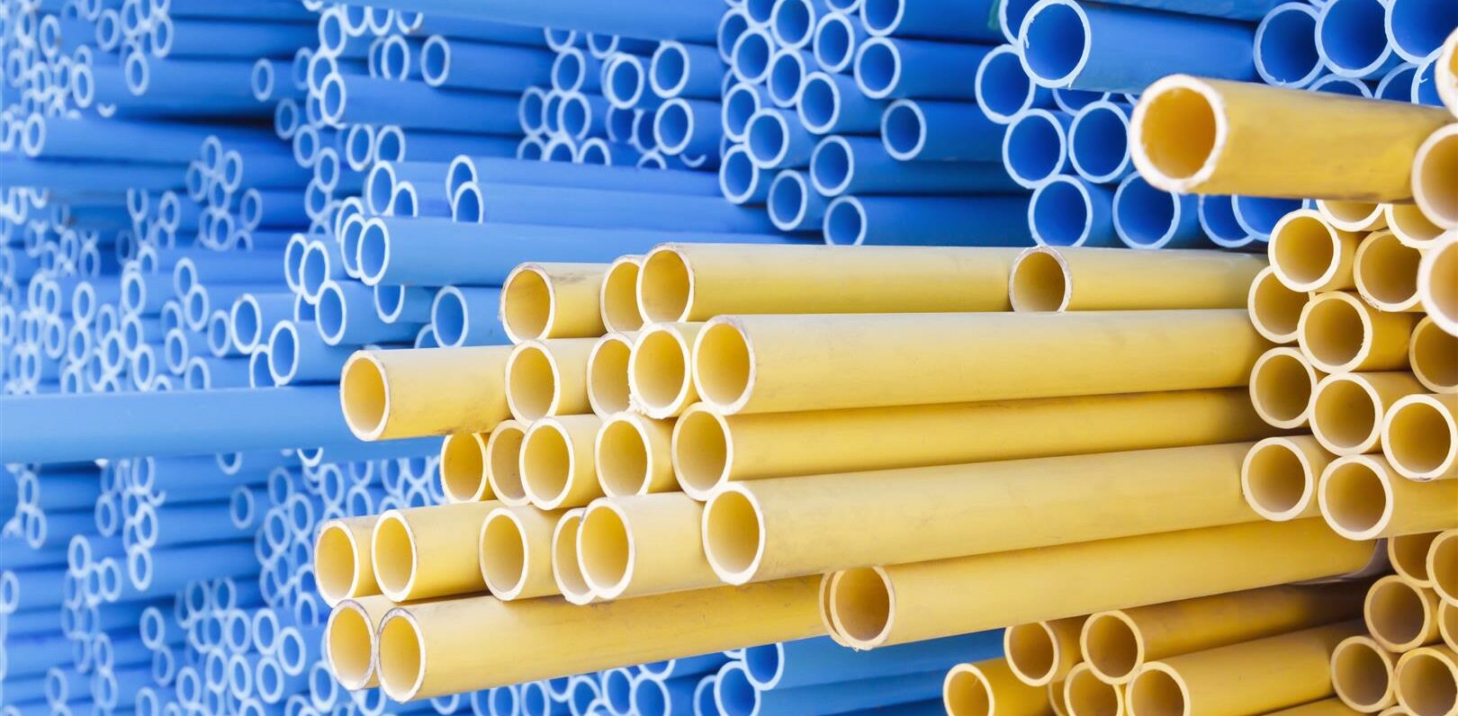 PVC pipes for electric conduit (yellow) and water (blue)